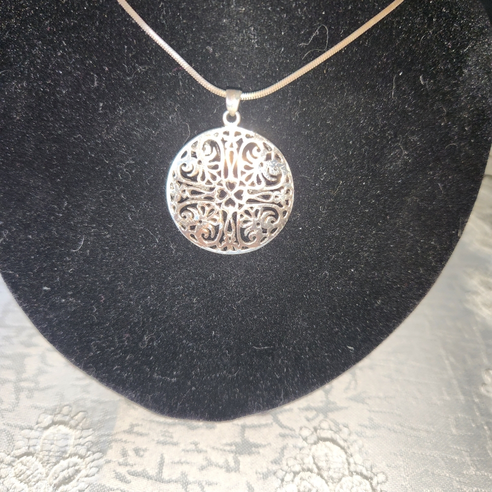 Women's 925 Intricate Disc on a 925 Snake Chain.
